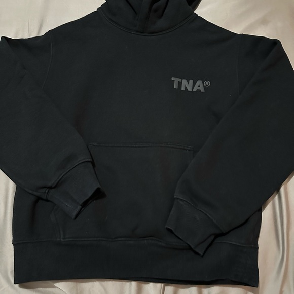 Aritzia Tops - Aritzia TNA logo hoodie.